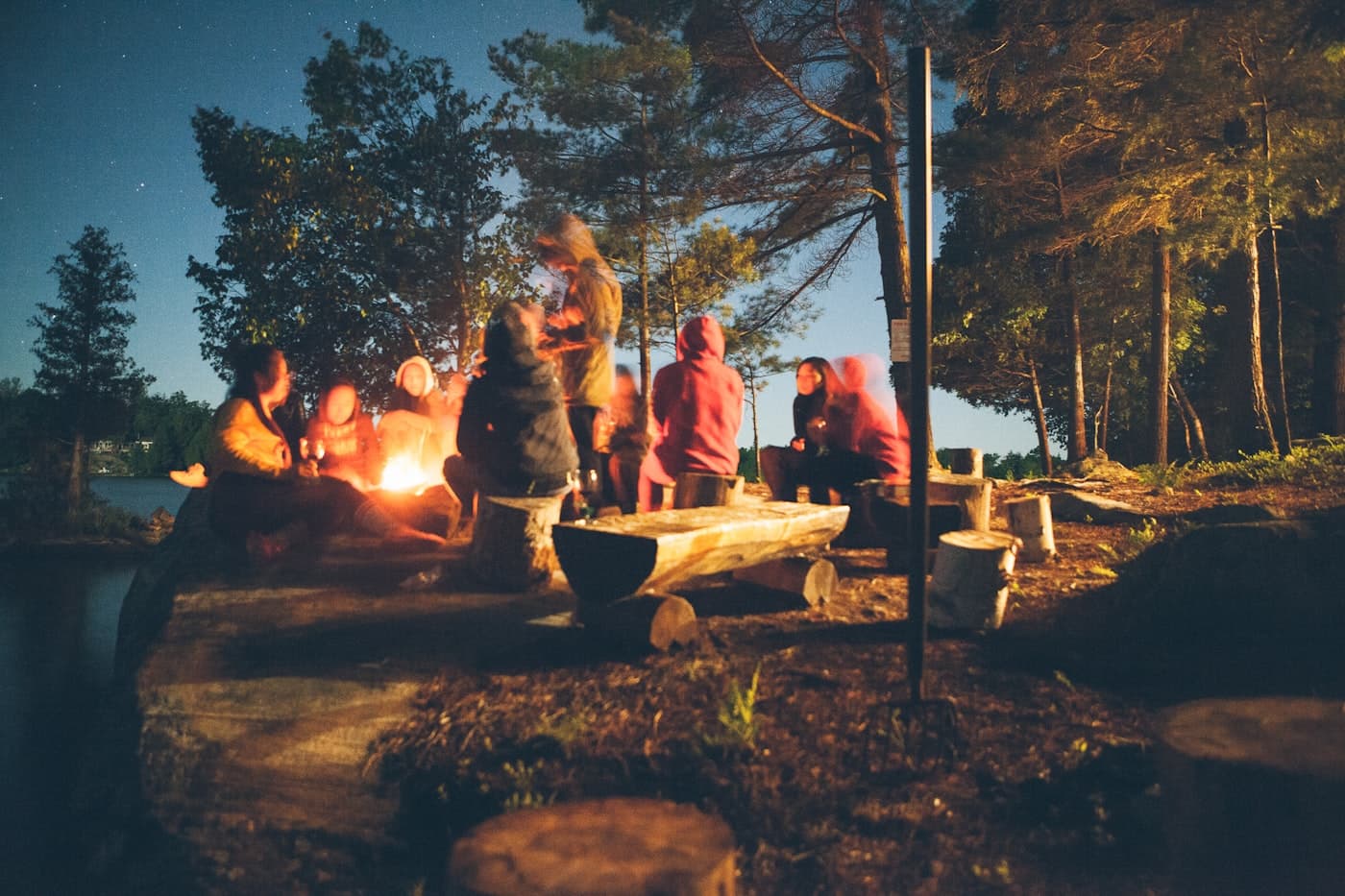 Camping chair set up outdoors near a tent
